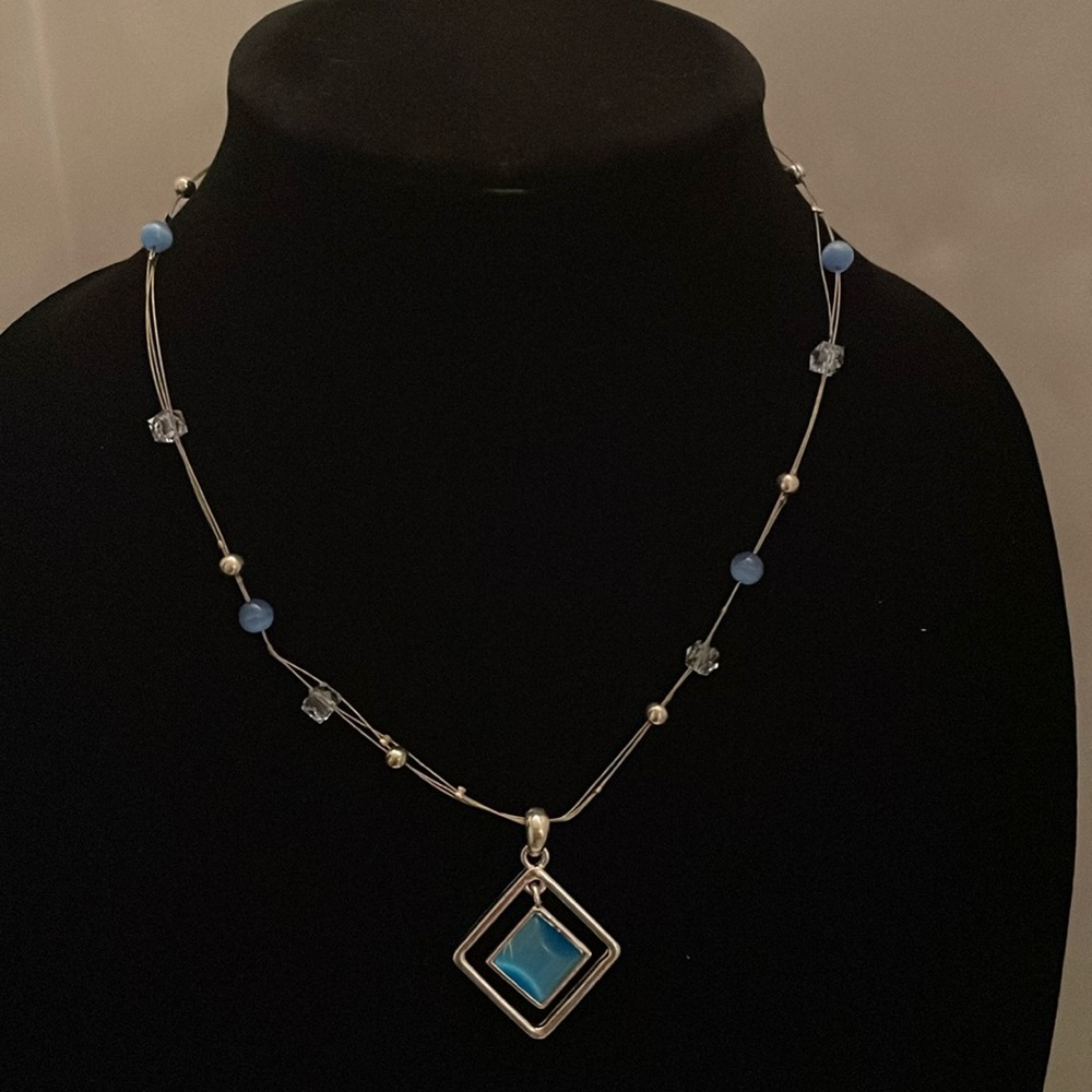 Necklace (3 strands) with silver, clear and light blue beads, beautiful pendant